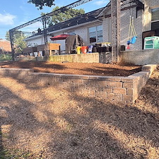 Custom-Belgard-Castle-Manor-Retaining-Wall-Raised-Flowerbed-Installation-in-Nashville-TN 0